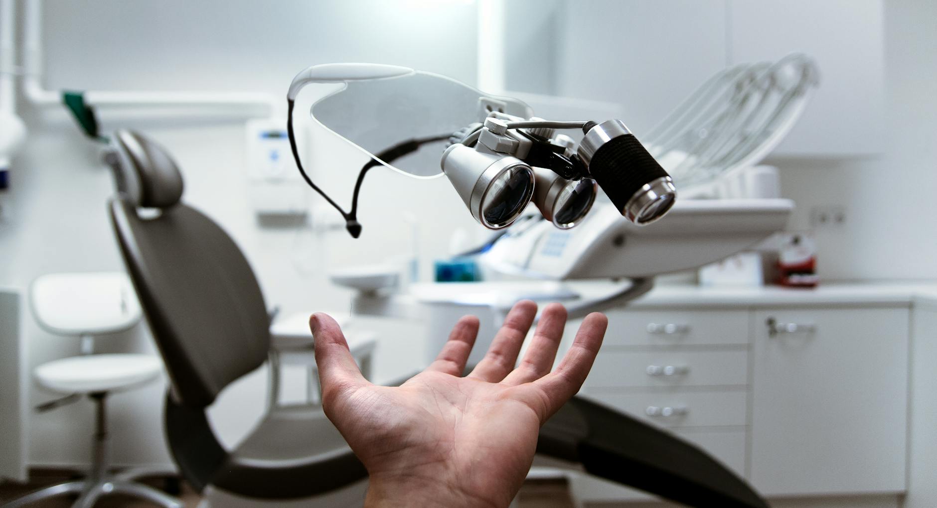person showing magnifying eyeglasses