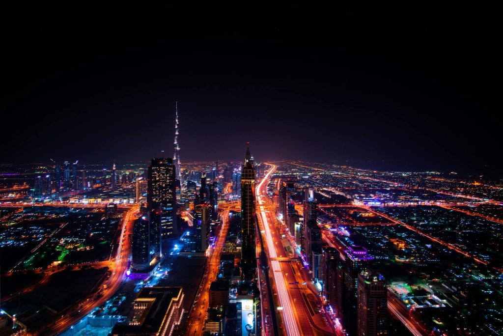 high rise buildings during night time photo